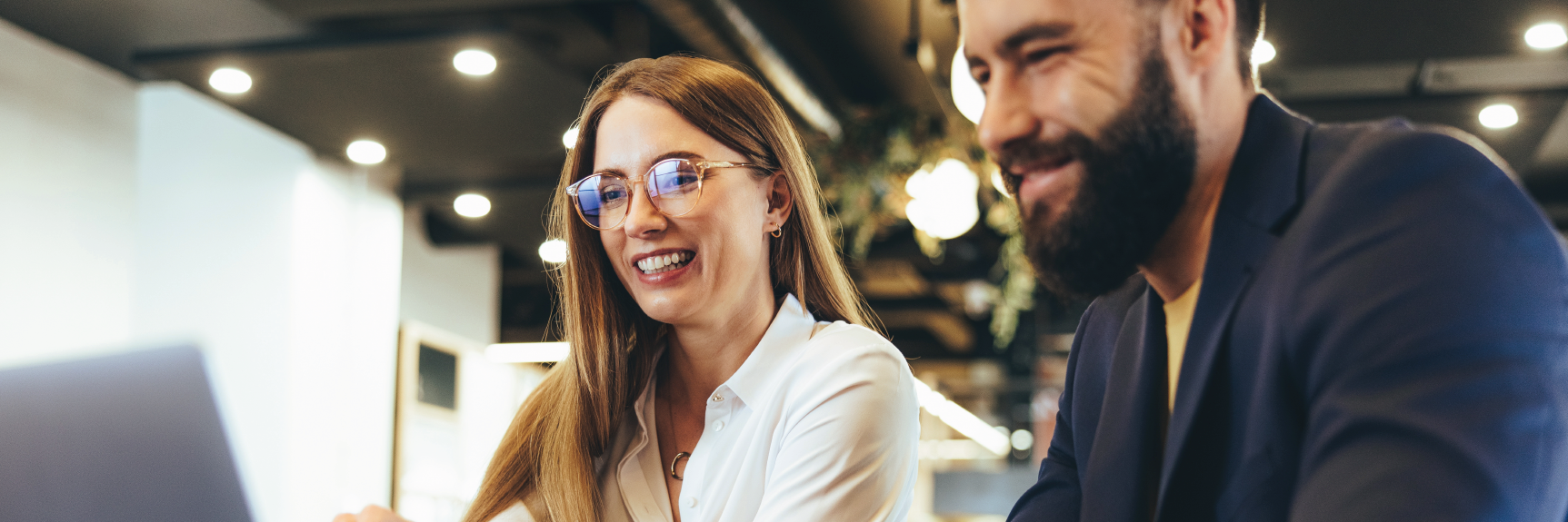 Photo of two students working together
