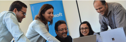 Employees working together on desktop