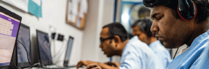 Employees working with  headsets.