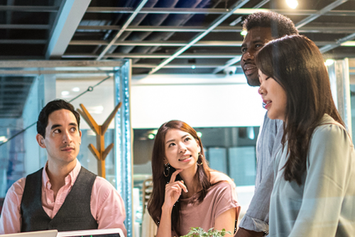 Photo of employees working together